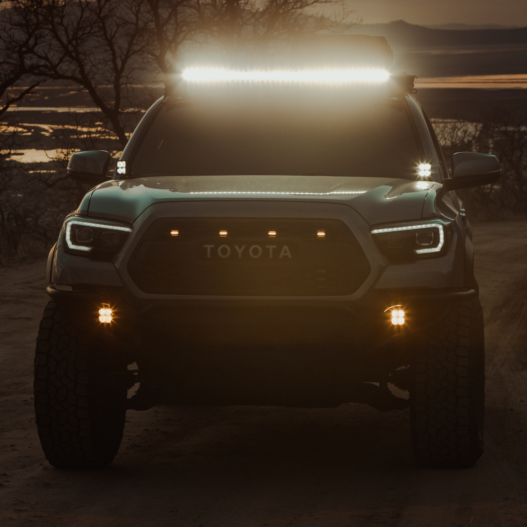 quattro led pod light mounted on a toyota tacoma as a fog light